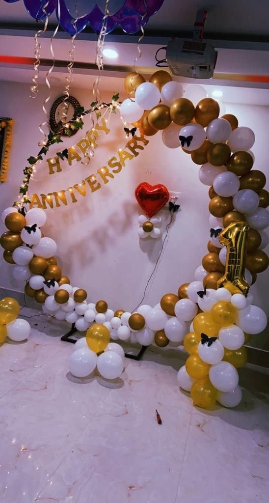 White and yellow Anniversary Balloon Setup