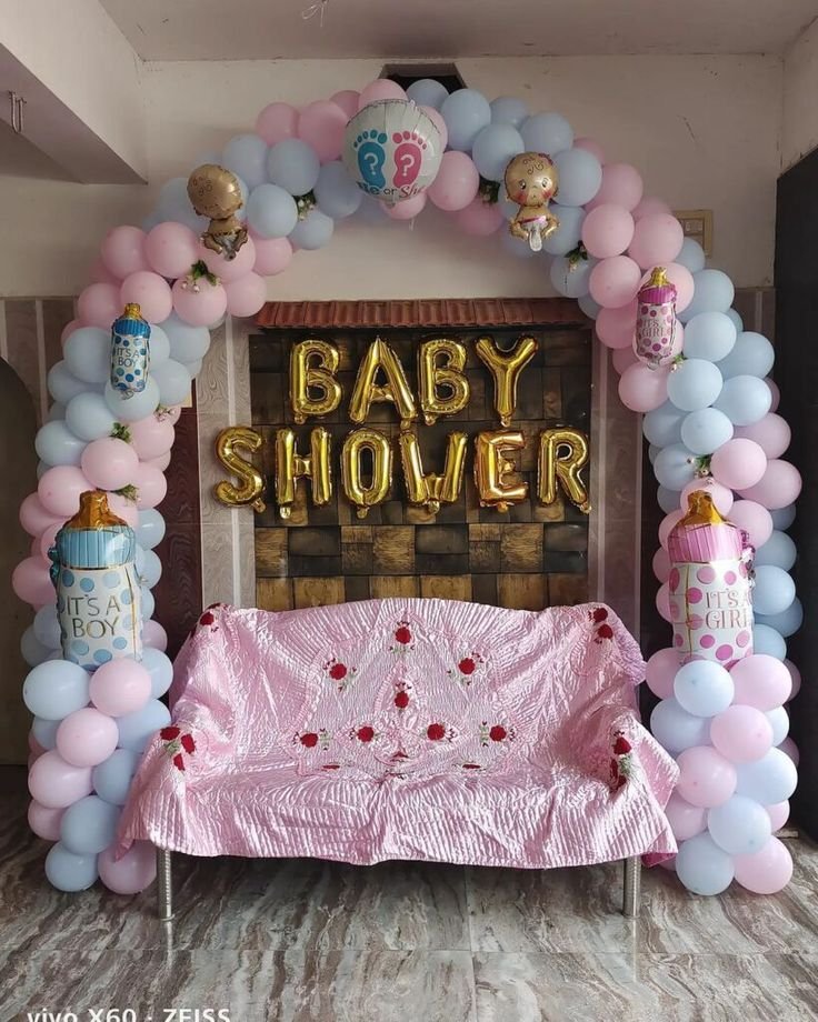 Baby shower balloon decoration with elegant themed setup and backdrop